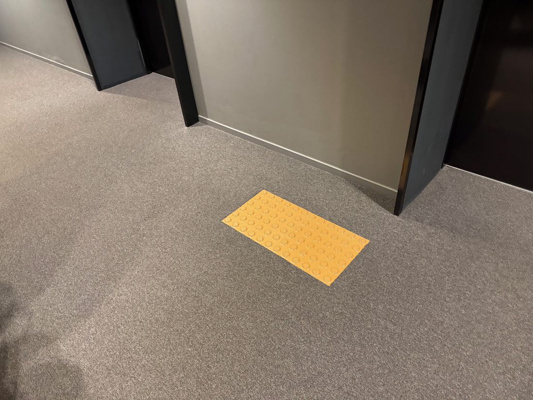 pedestrian rumble strips for elevator call buttons